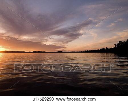 Lake of the Woods, Ontario, Canada; Twilight over still lake water View Large Photo Image Stock Image - Lake of the Woods, Ontario, Canada; Twilight over still lake water. Fotosearch