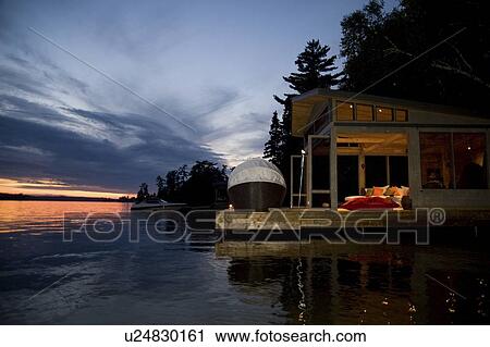 Lake of the Woods, Ontario, Canada; House set over the lake facing sunset View Large Photo Image Stock Image - Lake of the Woods, Ontario, Canada; House set over the lake facing sunset. Fotosearch