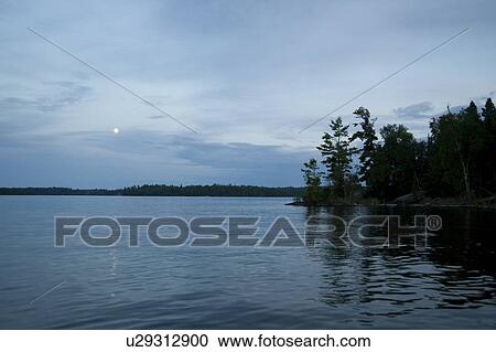 Lake of the Woods, Ontario, Canada; Moon rising above lake View Large Photo Image Stock Image - Lake of the Woods, Ontario, Canada; Moon rising above lake. Fotosearch