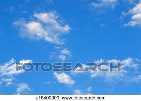 Stock Photo - Lake of the Woods, Ontario, Canada; Blue sky with white clouds. Fotosearch