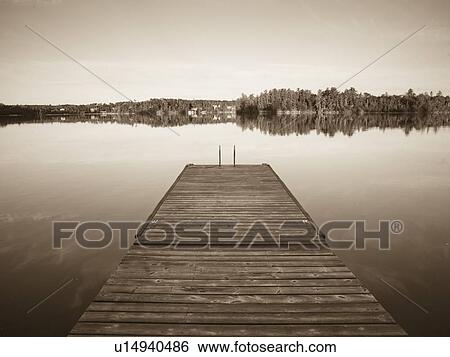 Stock Photograph - Lake of the Woods, Ontario, Canada; Dock on a lake. Fotosearch