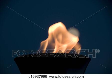 Stock Photograph - Lake of the Woods, Ontario, Canada; Torch burning brightly at night. Fotosearch