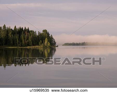 Lake of the Woods, Ontario, Canada; Early morning view over the lake View Large Photo Image Stock Photography - Lake of the Woods, Ontario, Canada; Early morning view over the lake . Fotosearch