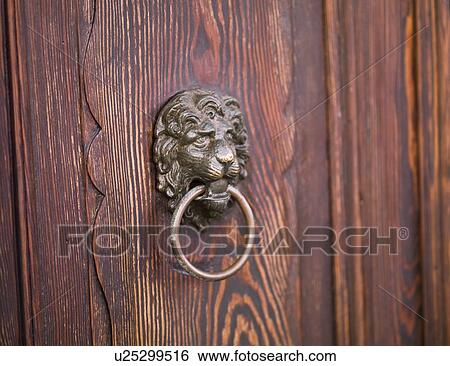 Stock Photograph - Lion door knocker. Fotosearch