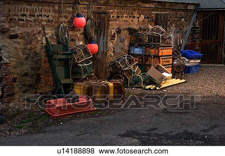 Stock Photo - Lobster traps stacked up against a wall. Fotosearch