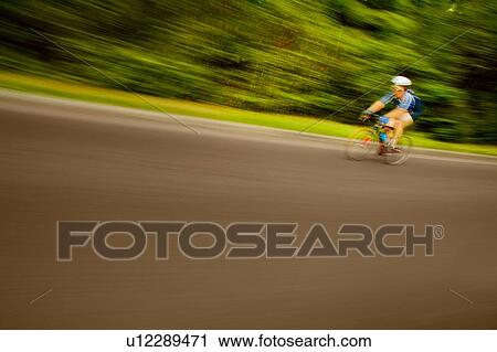 Stock Image - Lone cyclist. Fotosearch