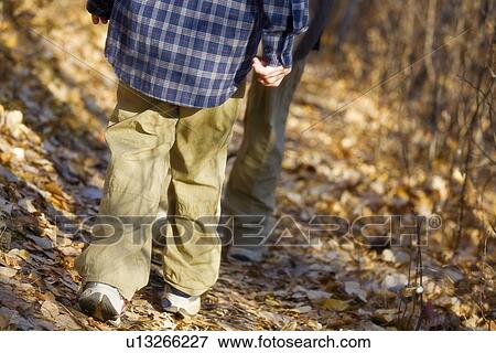 Low section of boy hiking View Large Photo Image Stock Photo - Low section of boy hiking. Fotosearch