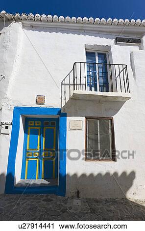 Macharaviaya, Malaga Province, Spain; house with blue and yellow door View Large Photo Image Stock Image - Macharaviaya, Malaga Province, Spain; house with blue and yellow door . Fotosearch