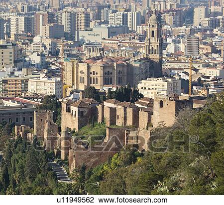 Malaga, Malaga Province, Costa del Sol, Spain; View over city, cathedral and walls of Alcazaba View Large Photo Image Stock Image - Malaga, Malaga Province, Costa del Sol, Spain; View over city, cathedral and walls of Alcazaba. Fotosearch