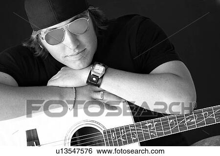 Stock Photograph - Male with guitar. Fotosearch