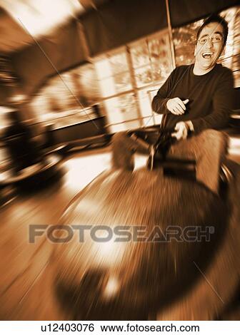 Stock Photograph - Man at amusement park. Fotosearch
