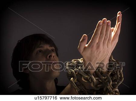 Man in chains View Large Photo Image Stock Photograph - Man in chains. Fotosearch
