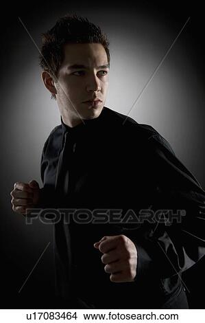 Picture - Man in fighting stance. Fotosearch