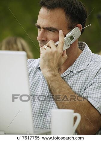 Man on cell phone View Large Photo Image Stock Photography - Man on cell phone. Fotosearch