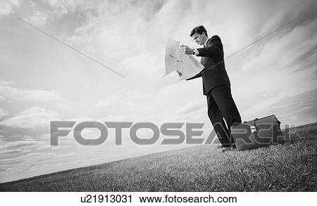 Man reading map View Large Photo Image Stock Image - Man reading map. Fotosearch