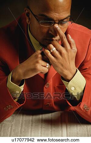 Stock Image - Man reads Wall Street Journal. Fotosearch