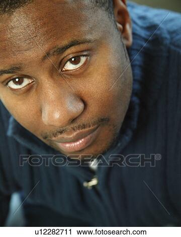 Stock Image - Man with brown eyes. Fotosearch
