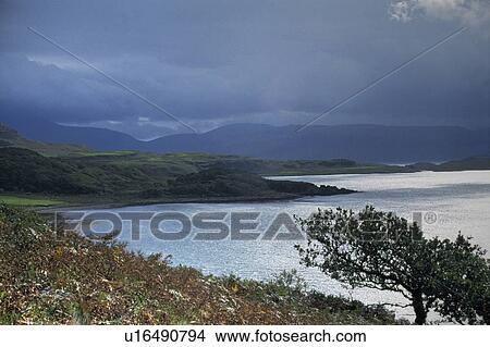 Mull, Scottish Highlands, Scotland, United Kingdom; Coastline in front of a rolling landscape View Large Photo Image Picture - Mull, Scottish Highlands, Scotland, United Kingdom; Coastline in front of a rolling landscape. Fotosearch