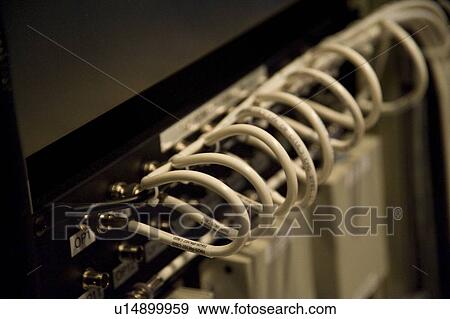 Stock Photo - Multiple computer cables in back of console. Fotosearch