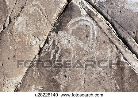 Stock Image - Native American petroglyphs found in the Owens Valley, California, USA . Fotosearch