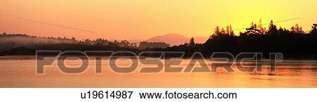 Stock Photo - Near Sneem, Co Kerry, Ireland; Sunrise at Oysterbed Harbour. Fotosearch