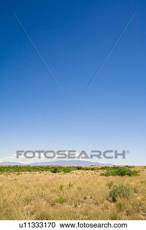 Stock Image - New Mexico, USA; Desert landscape with the Manzano Mountains in the background. Fotosearch