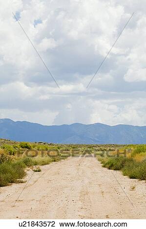 New Mexico, USA; Desert trail with mountains in the distance View Large Photo Image Stock Image - New Mexico, USA; Desert trail with mountains in the distance. Fotosearch
