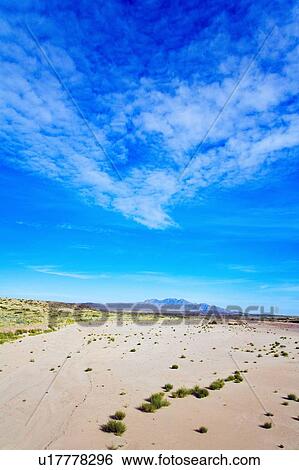 Stock Photograph - New Mexico, USA; Expansive desert with the Sierra Ladrones mountains in the distance. Fotosearch