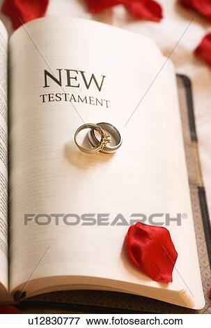 New Testament; New Testament and Wedding Rings View Large Photo Image Stock Photo - New Testament; New Testament and Wedding Rings. Fotosearch