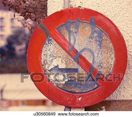 Old graffiti covered 'No Parking To Left' sign View Large Photo Image Stock Photo - Old graffiti covered 'No Parking To Left' sign. Fotosearch