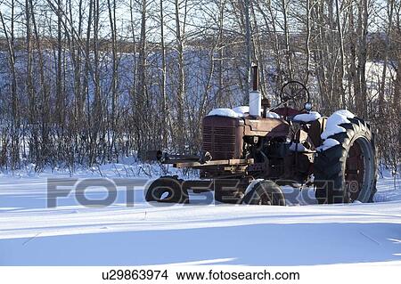 Old tractor in the snow View Large Photo Image Picture - Old tractor in the snow. Fotosearch