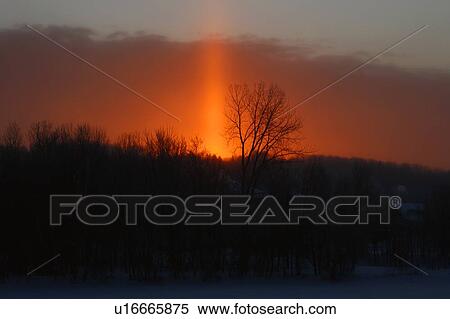 Orange sunset behind a snow covered country town View Large Photo Image Stock Photography - Orange sunset behind a snow covered country town. Fotosearch