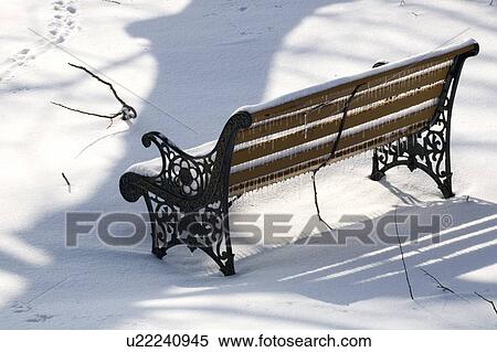 Park bench covered in snow View Large Photo Image Stock Photography - Park bench covered in snow. Fotosearch