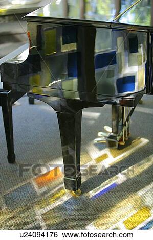 Piano with stained glass reflection View Large Photo Image Stock Photograph - Piano with stained glass reflection. Fotosearch