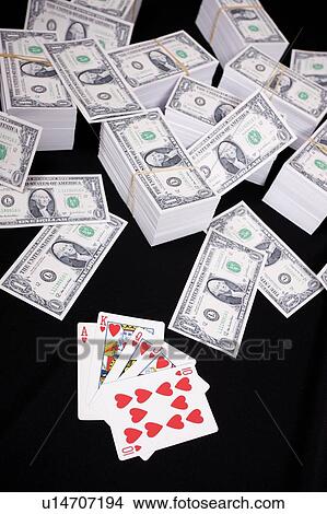 Piles of money and playing cards View Large Photo Image Picture - Piles of money and playing cards. Fotosearch
