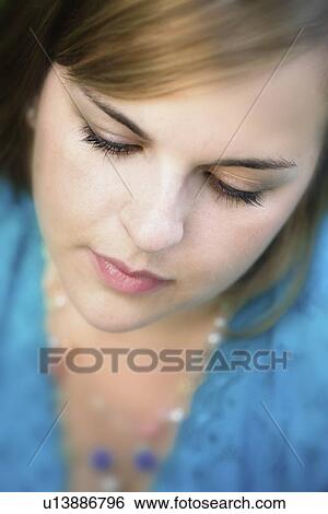 Stock Photograph - Portrait of a young woman. Fotosearch
