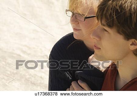 Stock Photo - Profile of two young people. Fotosearch