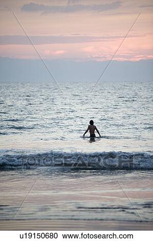 Stock Image - Puerto Vallarta, Mexico; Person in the water. Fotosearch