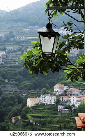 Stock Photography - Ravello, Italy; Lantern hanging with countryside behind. Fotosearch