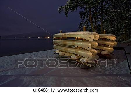 Stock Photo - Recreation; Pile of canoes. Fotosearch