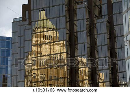 Stock Image - Reflection in glass building, Vancouver, British Columbia, Canada. Fotosearch