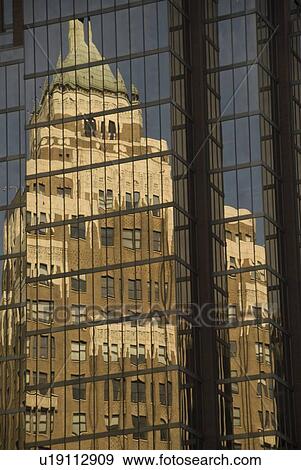 Stock Photo - Reflection in glass building, Vancouver, British Columbia, Canada. Fotosearch