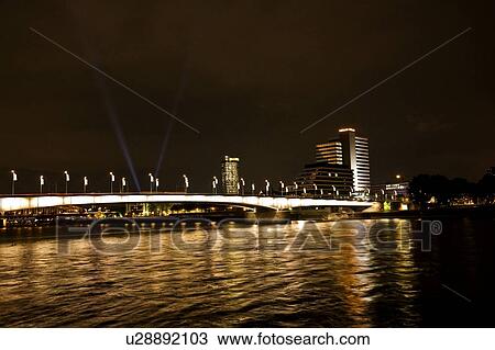 Rhine River, Germany; City lights and buildings by a river View Large Photo Image Stock Image - Rhine River, Germany; City lights and buildings by a river. Fotosearch
