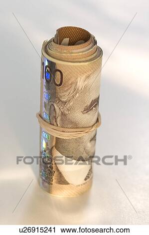 Roll of Canadian one hundred dollar bills View Large Photo Image Stock Image - Roll of Canadian one hundred dollar bills. Fotosearch