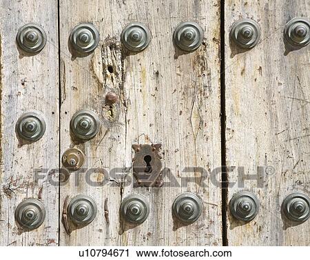 Stock Image - Ronda, Malaga Province, Spain; old wooden door. Fotosearch