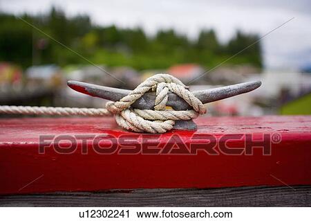 Rope tied to dock cleat View Large Photo Image Stock Image - Rope tied to dock cleat. Fotosearch