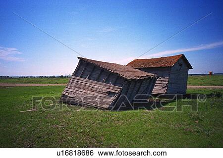 Stock Photograph - Run down shacks in farmer's field. Fotosearch