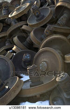 Stock Image - Rusted and piled up train wheels. Fotosearch