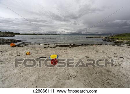 Sand toys on sandy beach View Large Photo Image Stock Image - Sand toys on sandy beach. Fotosearch