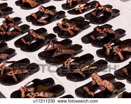 Stock Image - Sandals in a row. Fotosearch